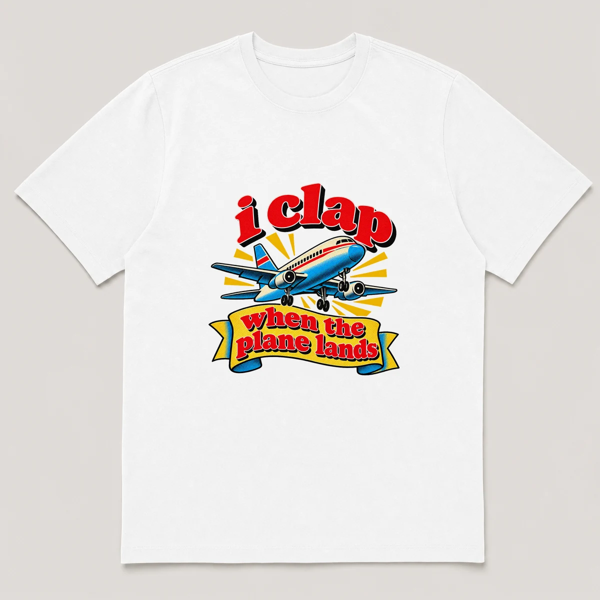 flat lay mockup of a heavyweight tee in black and white, front view, with the printed line i clap when the plane lands across the chest, White front view