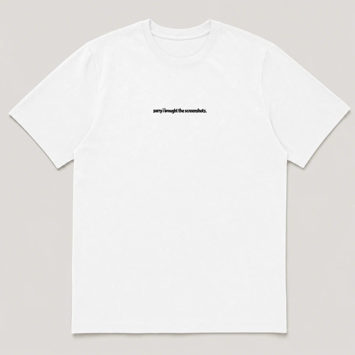 flat lay mockup of a heavyweight tee in black and white, front view, with the printed line sorry i brought the screenshots across the chest, White front view