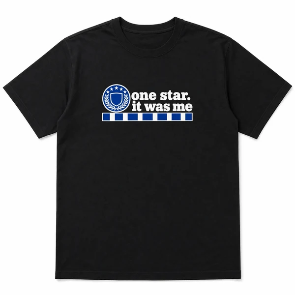 flat lay mockup of a heavyweight tee in black and white, front view, with the printed line one star. it was me across the chest
