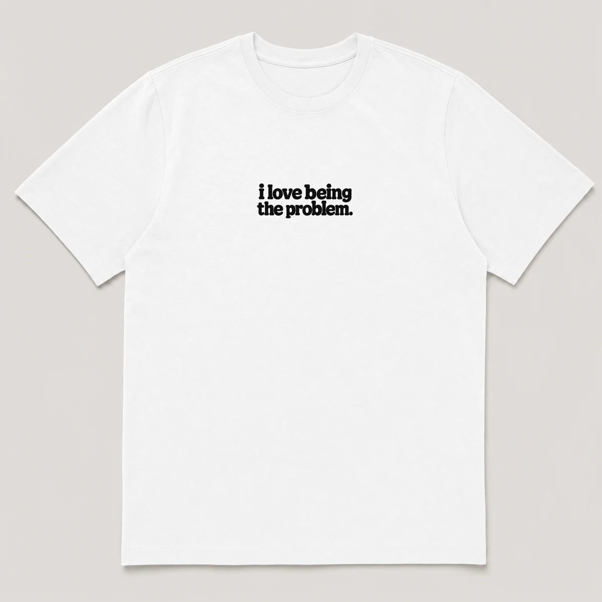 flat lay mockup of a heavyweight tee in black and white, front view, with the printed line i love being the problem across the chest, White front view