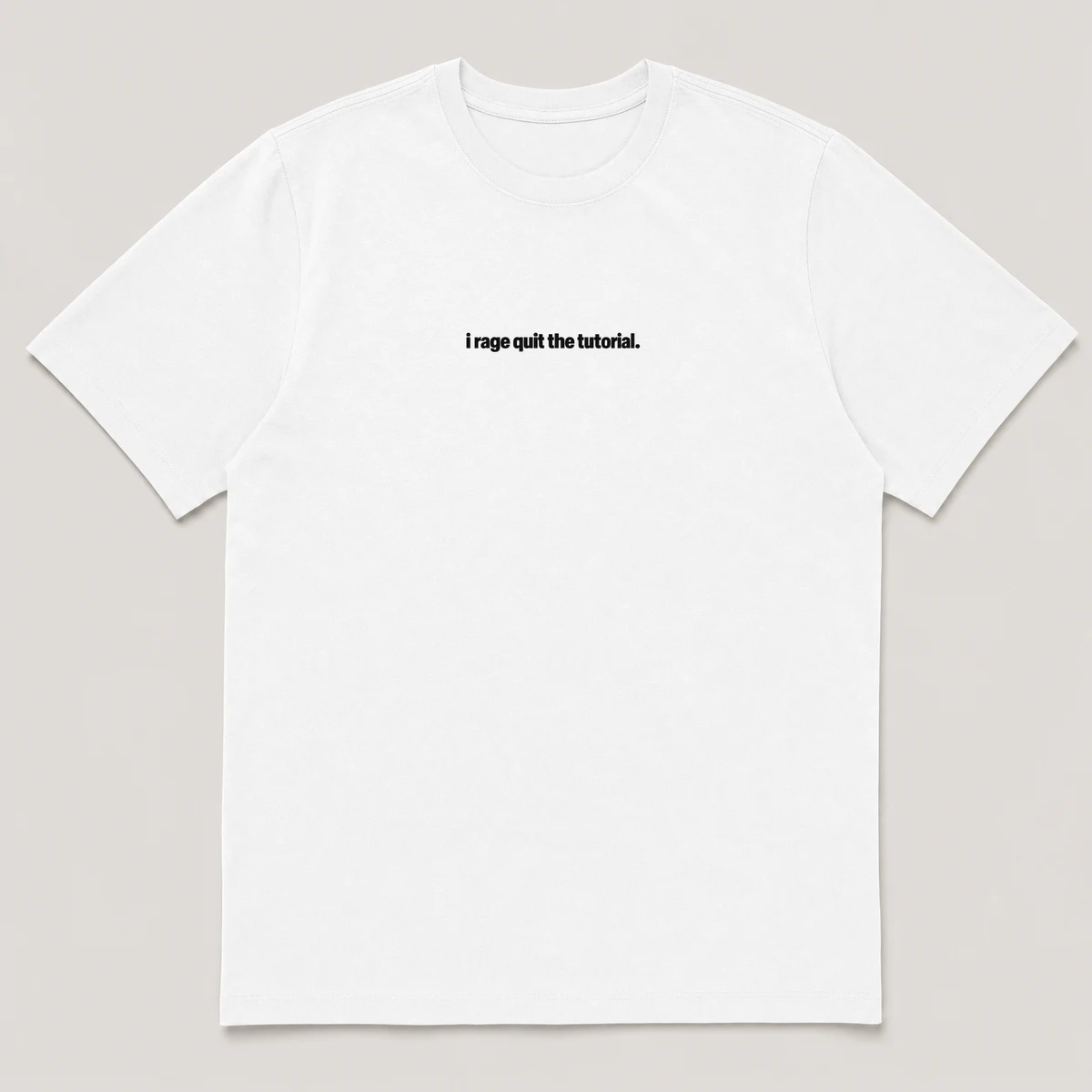 flat lay mockup of a heavyweight tee in black and white, front view, with the printed line i rage quit the tutorial across the chest, White front view
