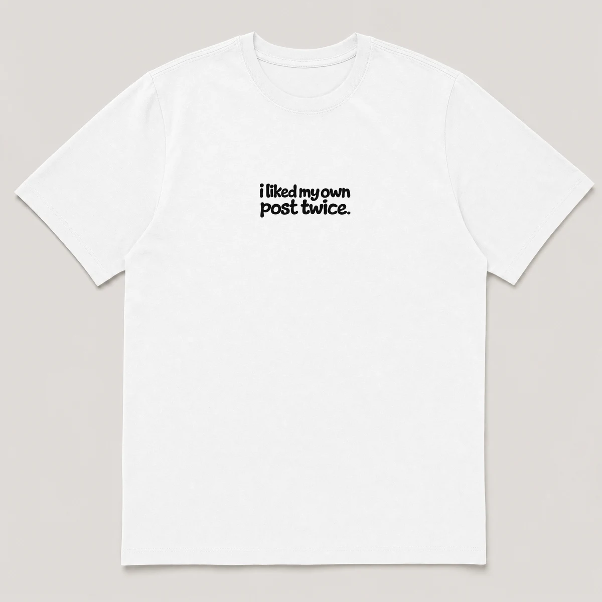 flat lay mockup of a heavyweight tee in black and white, front view, with the printed line i liked my own post twice across the chest, White front view
