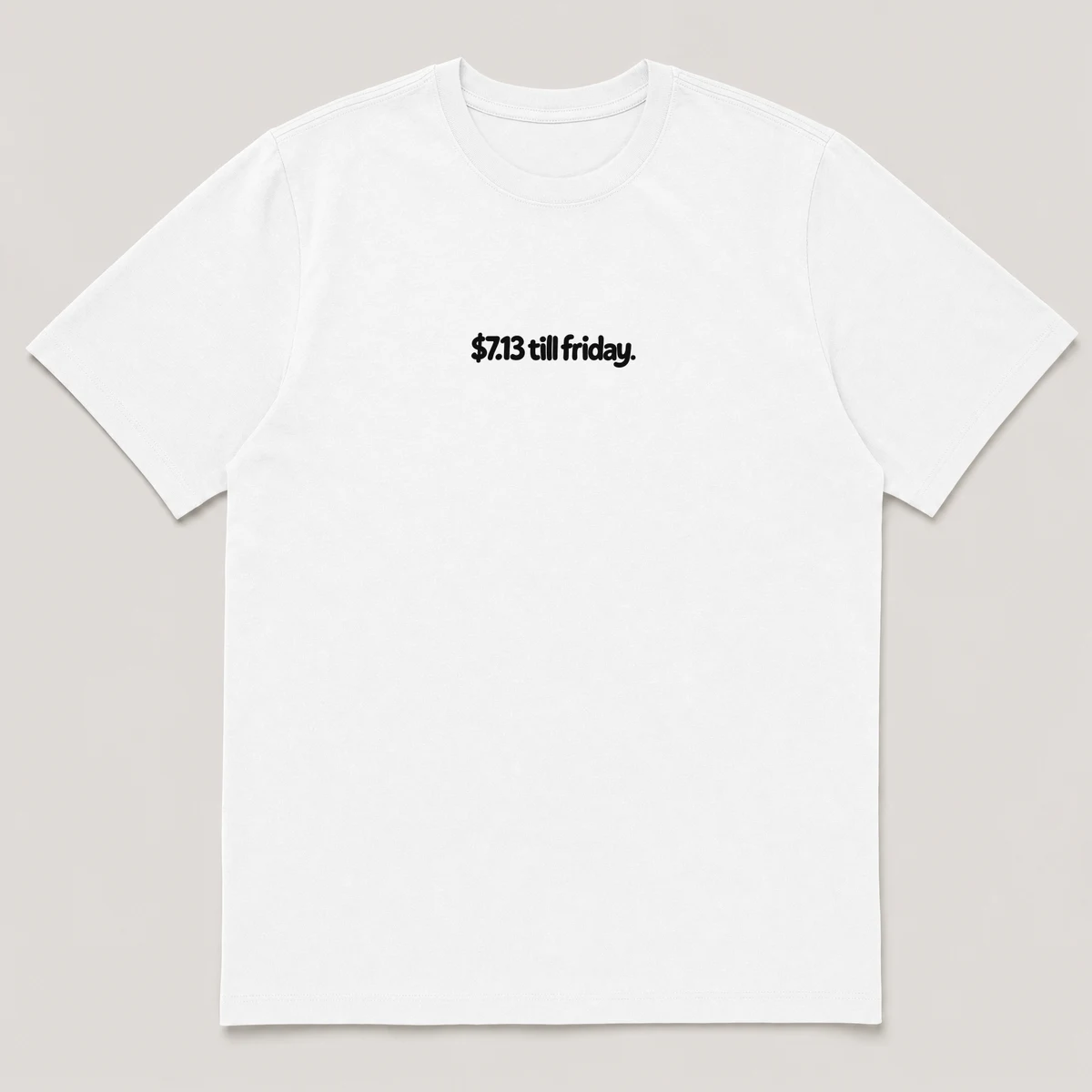 flat lay mockup of a heavyweight tee in black and white, front view, with the printed line $7.13 till friday across the chest, White front view